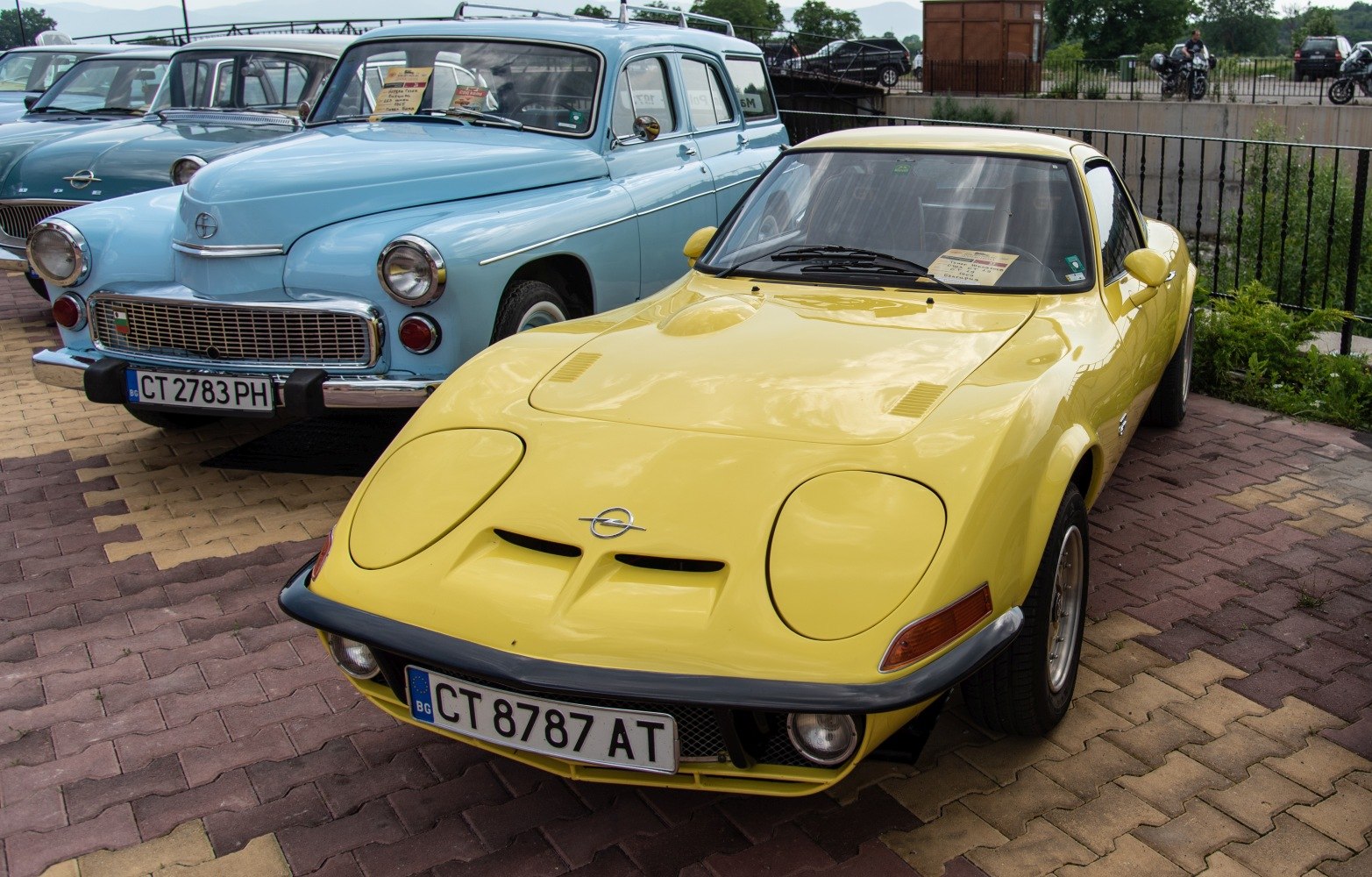 Yellow car front with pop-up headlights and sporty design