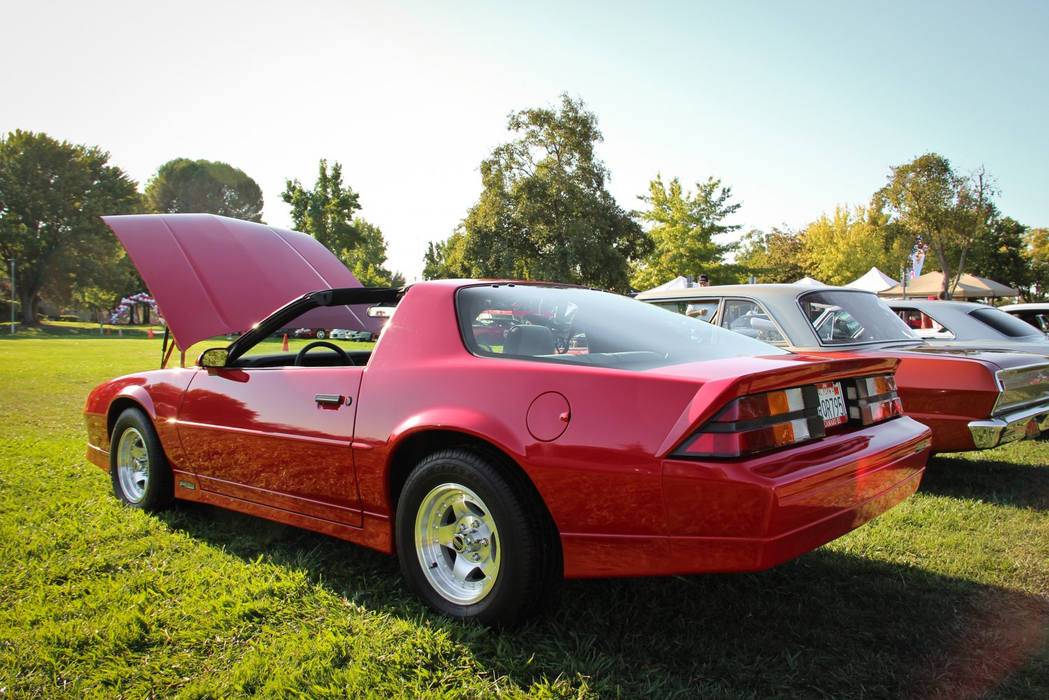 Red 1991 Camaro III with open T-top and rear spoiler