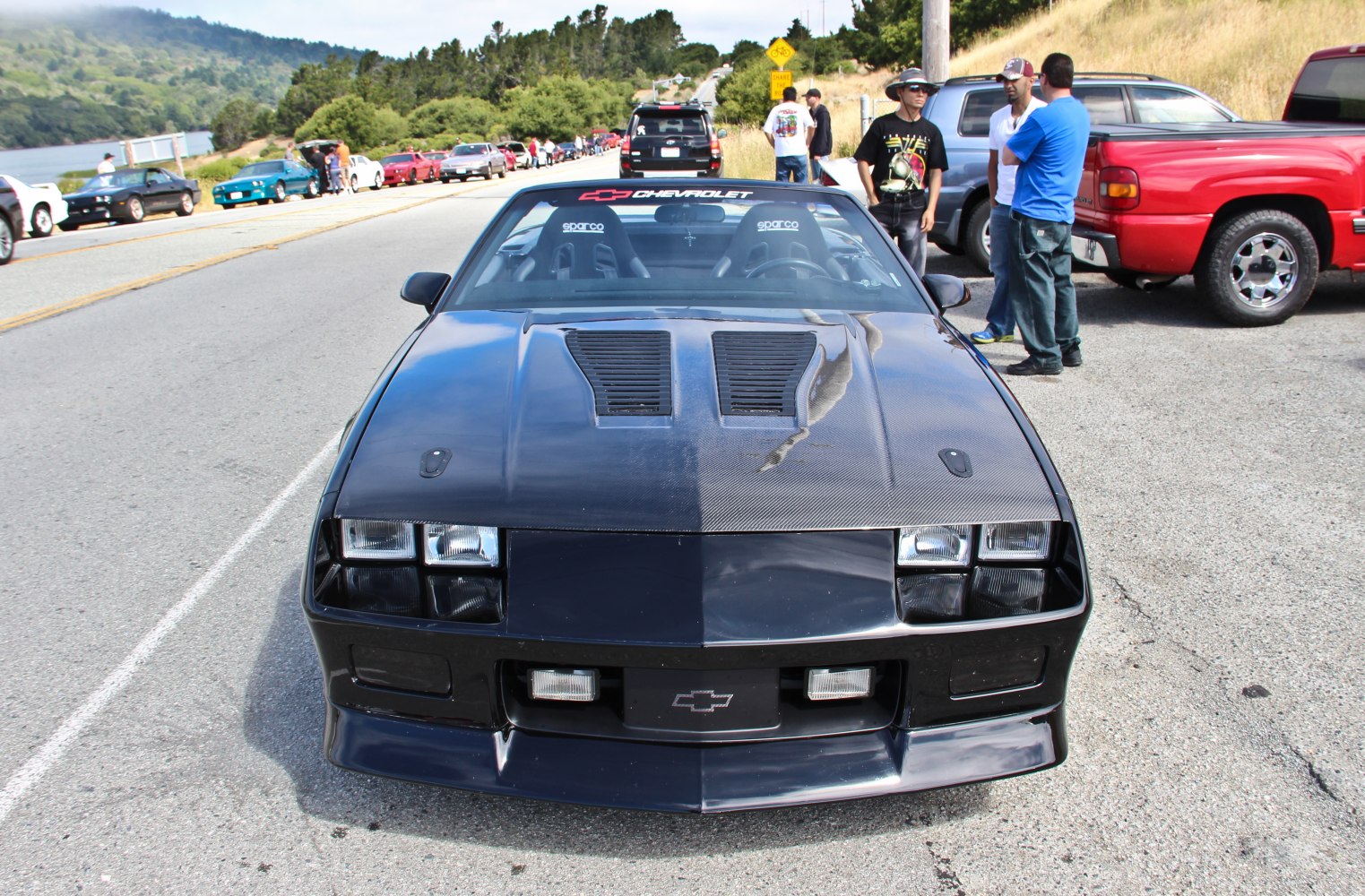 Ventilated hood with dual square headlights and racing seats inside
