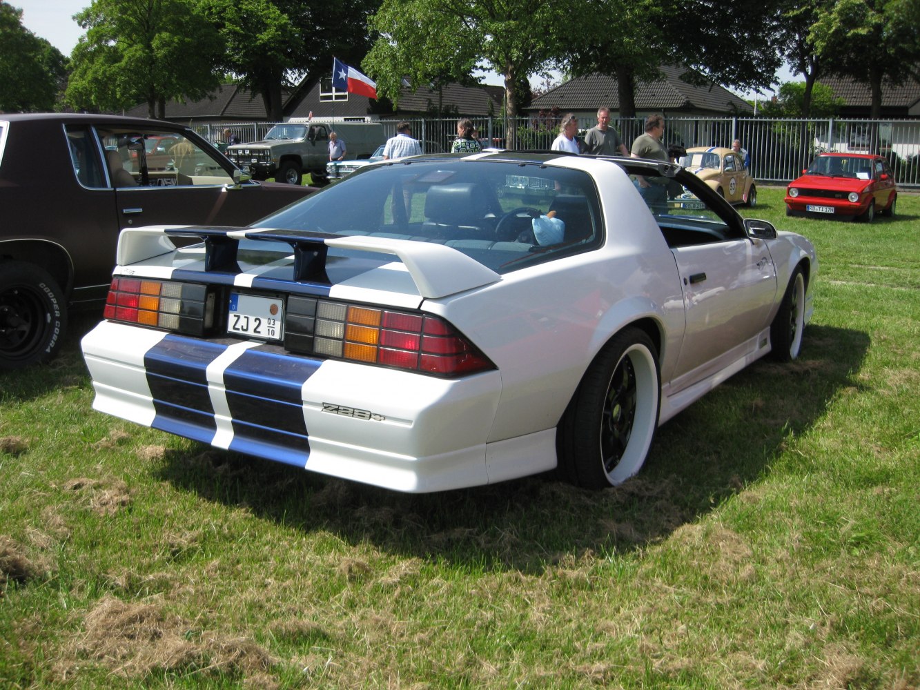 Rear view with racing stripes and prominent rear spoiler