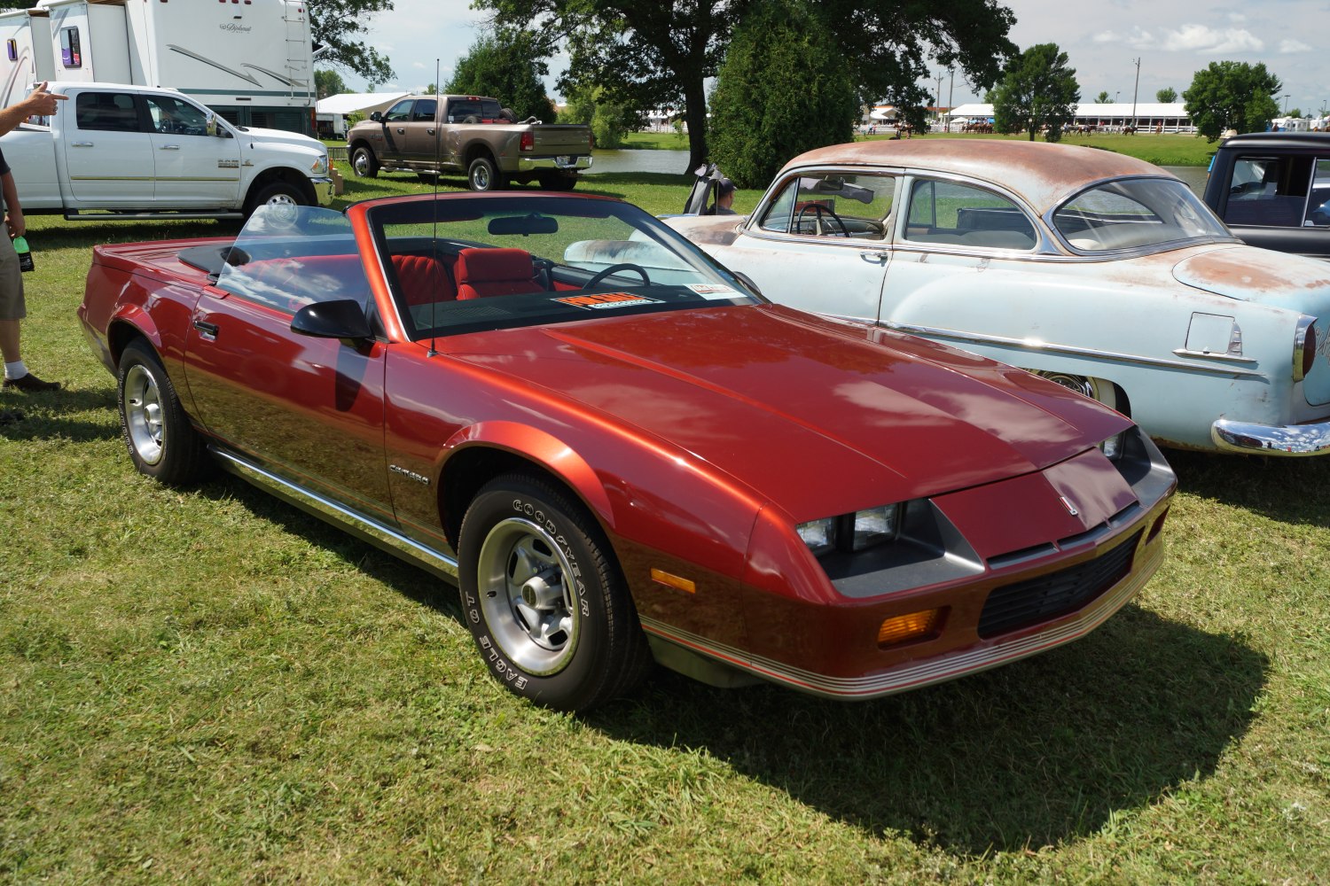 Convertible with pop-up headlights and sporty red exterior