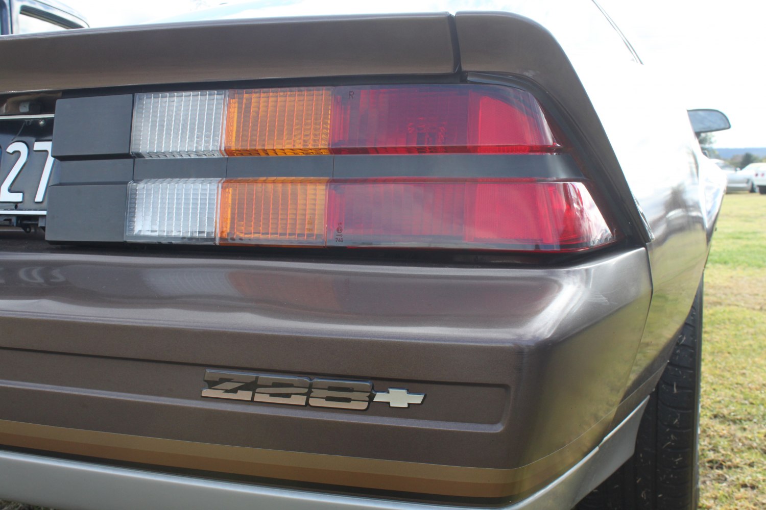 Close-up of rear tail light and Z28 badge on classic muscle car