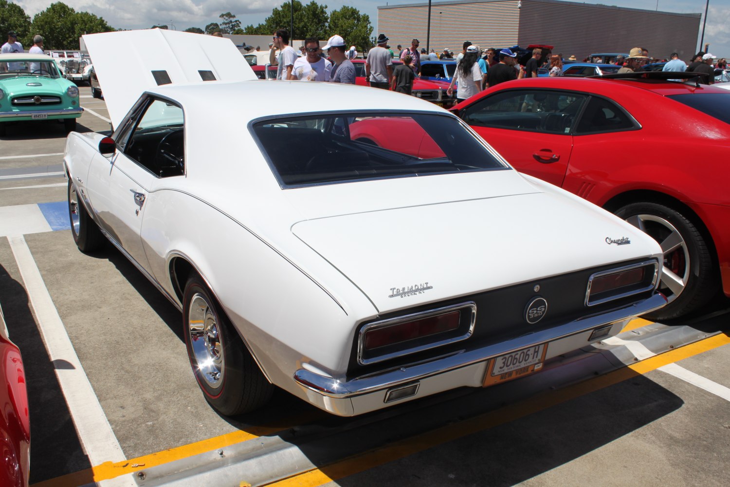 Rear view of classic white muscle car with distinctive taillights and SS 350 badge