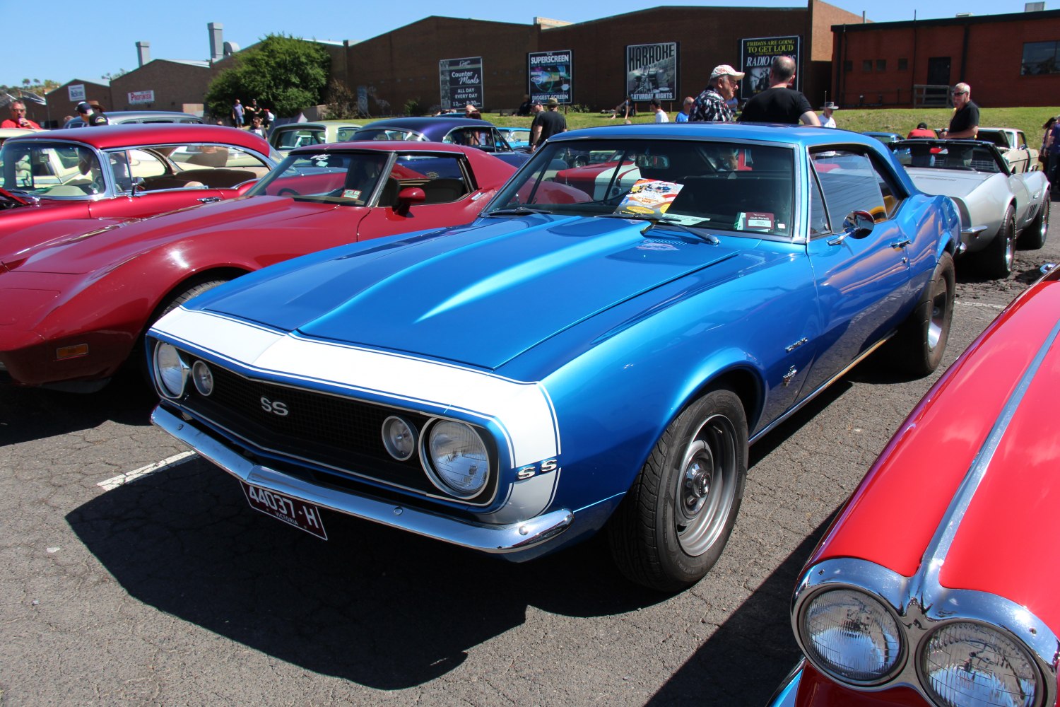 Classic muscle car front grille with dual headlights and SS badge