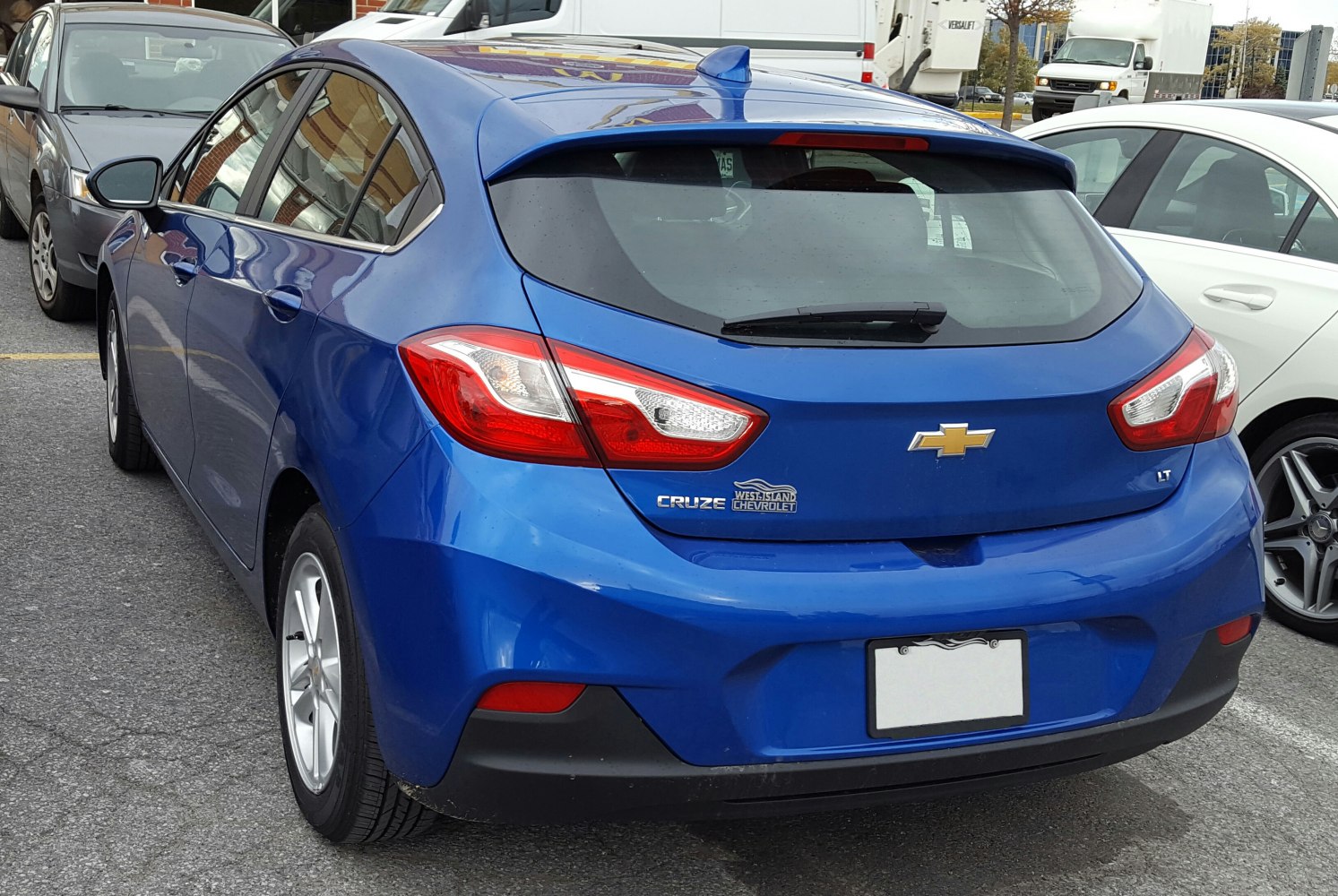 Compact hatchback rear with taillights and roof spoiler
