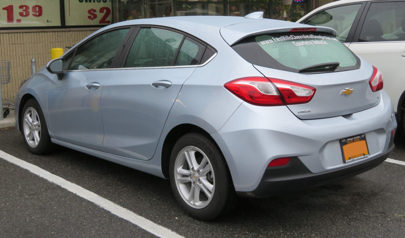 Silver hatchback rear side view with distinct taillights and alloy wheels