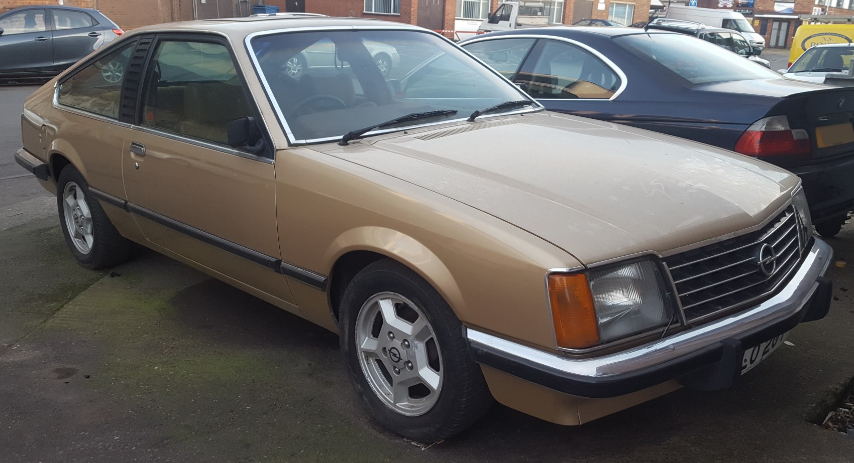 Front side angle of vintage coupe with alloy wheels and classic design