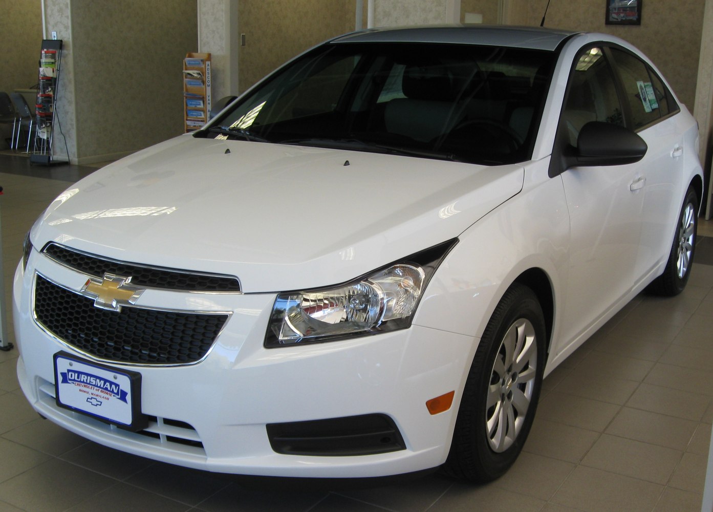White sedan with distinctive front grille and headlights