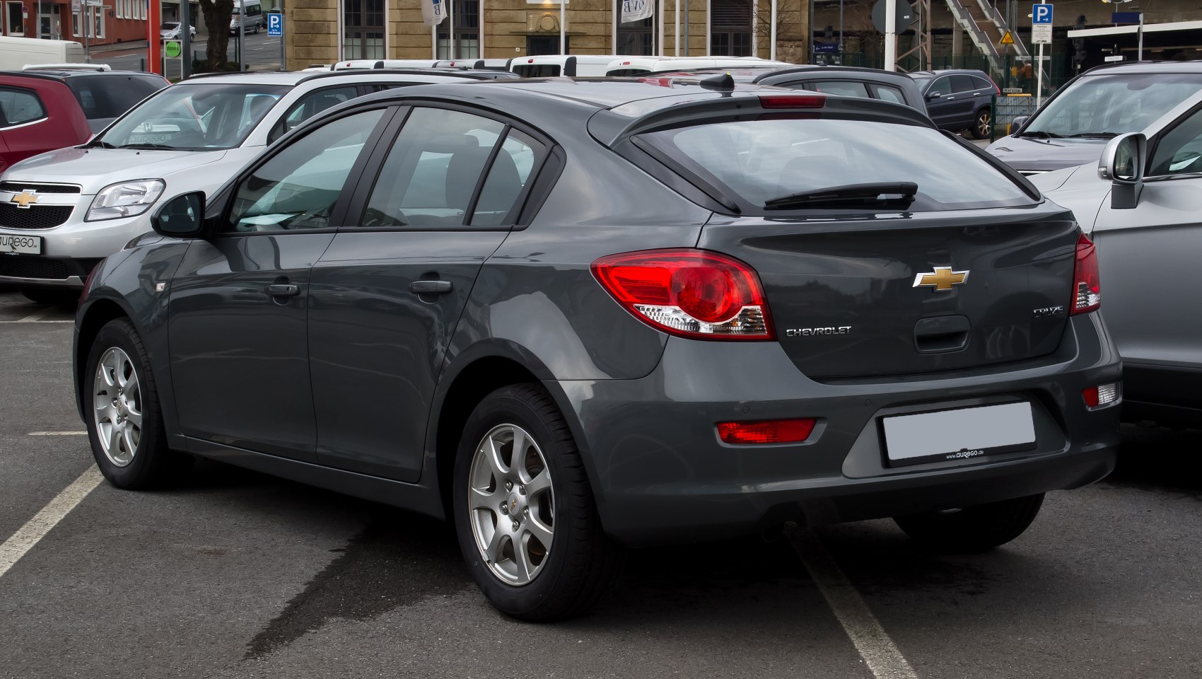 Hatchback rear side view with alloy wheels and distinctive taillights.