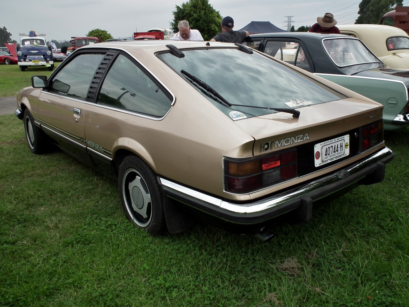 Rear hatchback design with rear window wiper and vintage taillights