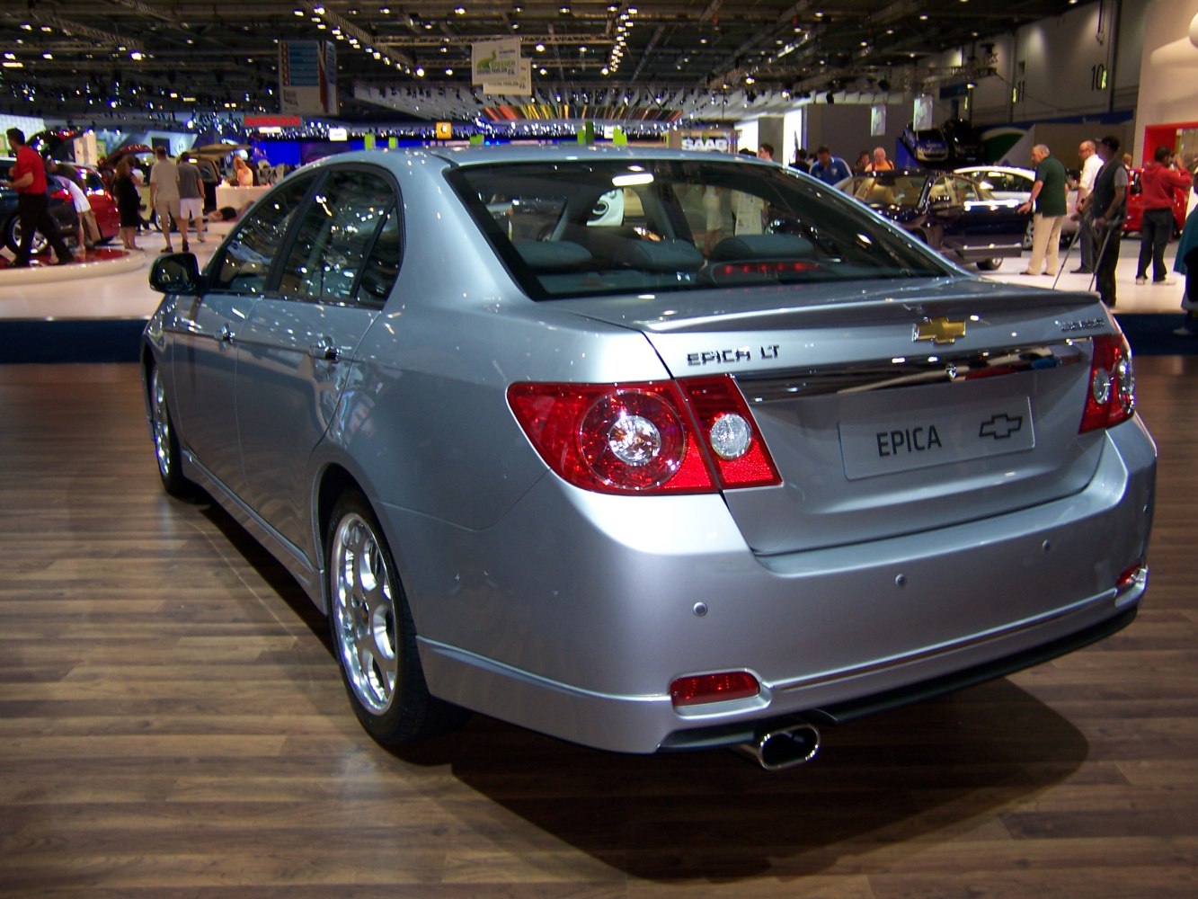 Silver mid-size sedan rear with distinct tail lights and single exhaust