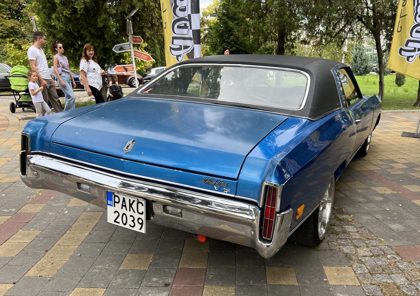 Rear view of classic 1970s vintage car with vinyl roof and chrome bumper