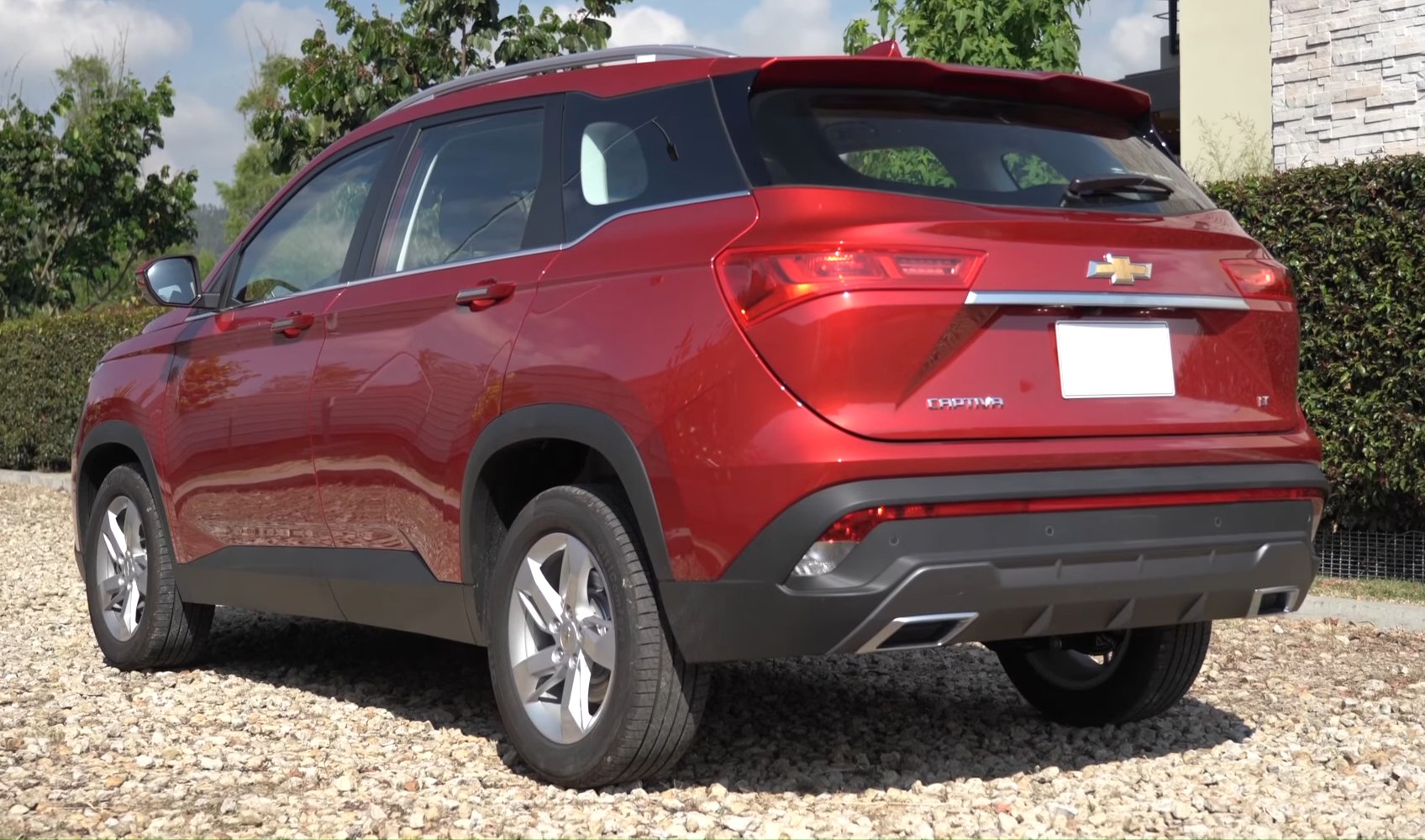 Rear-side profile with tail lights and alloy wheels detail