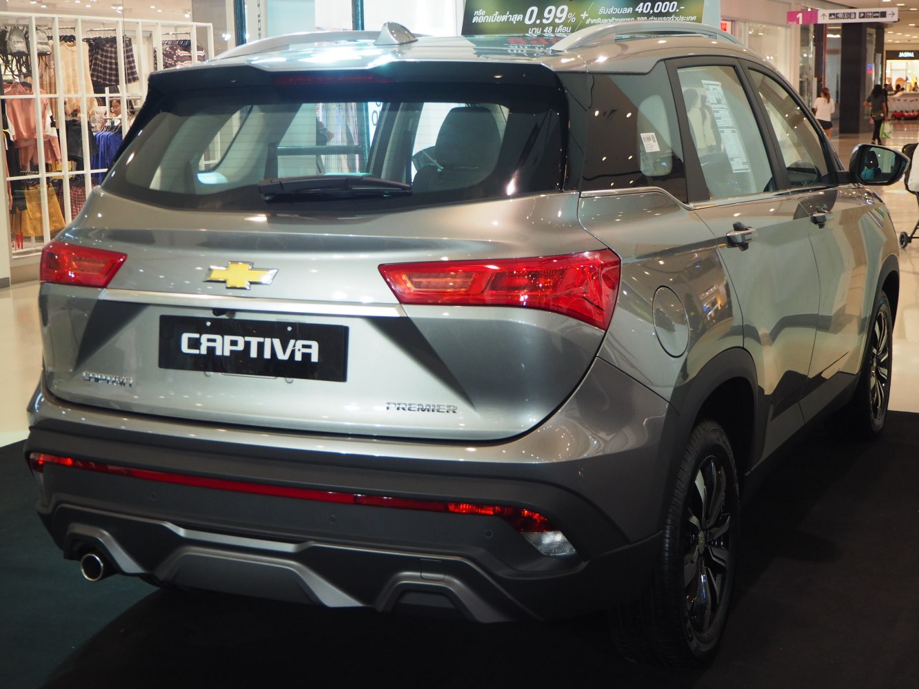 Rear view of modern SUV with sleek taillights and sporty bumper