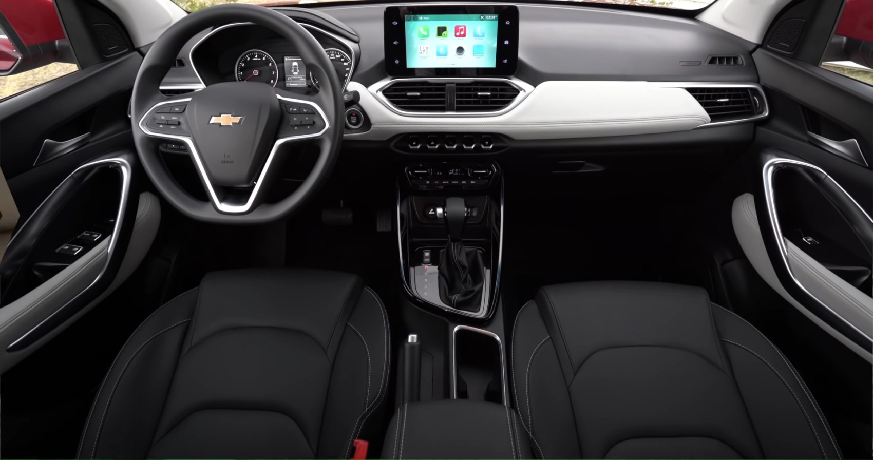 Modern car interior with dashboard, touchscreen, and steering wheel