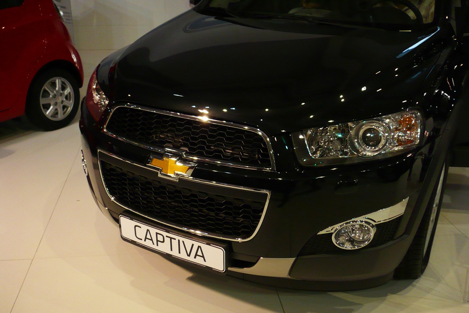 Front grille and detailed headlights with fog light on black SUV