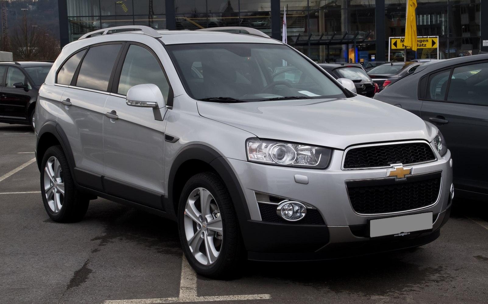 Silver SUV front and side profile with detailed headlights and alloy wheels