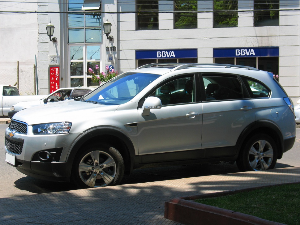 Silver SUV with alloy wheels, roof rails, side profile view