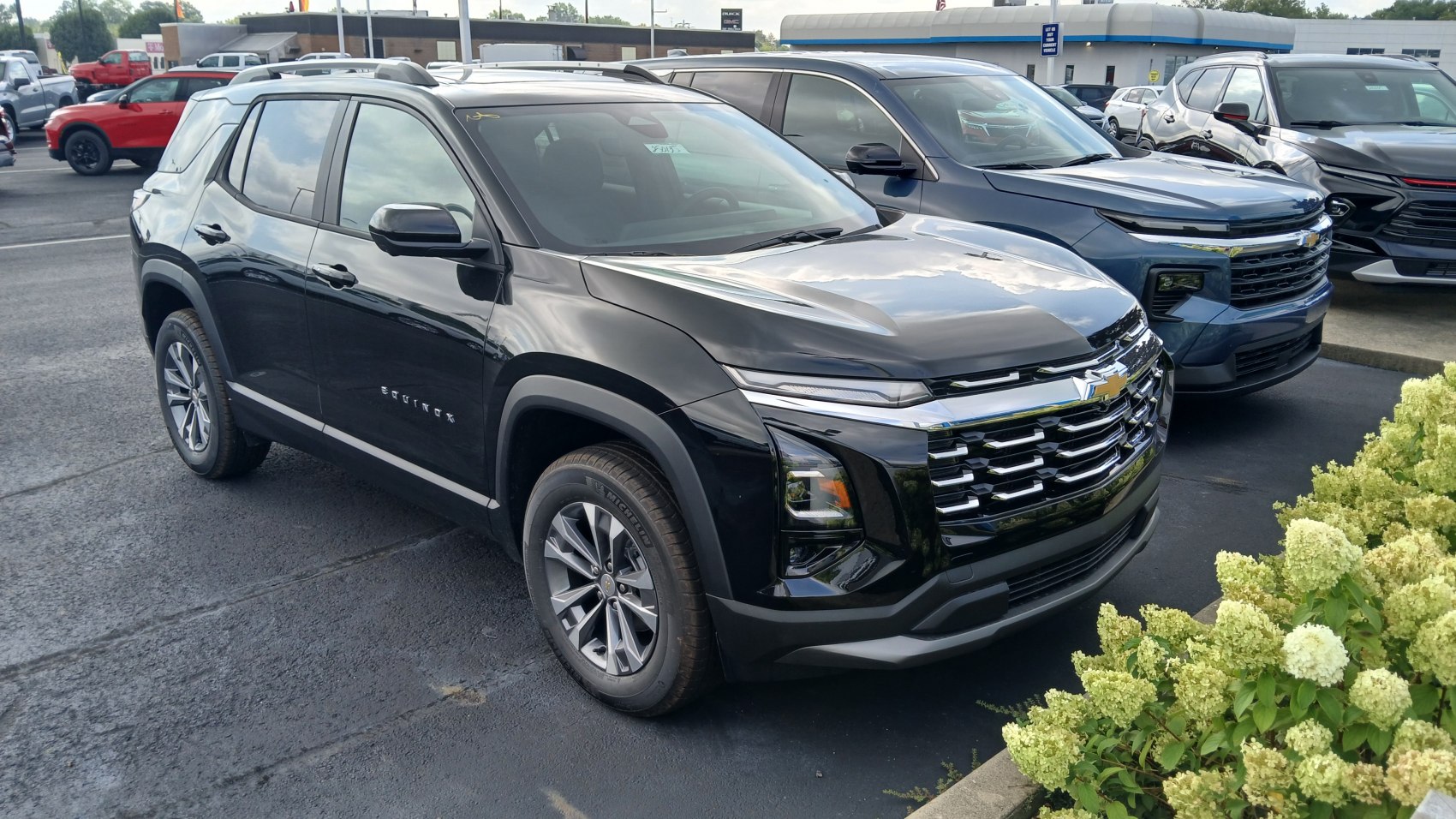 Black SUV with bold front grille and sleek modern headlights.