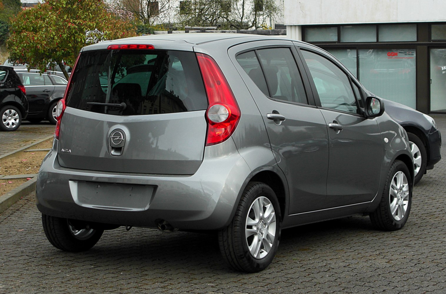 Compact hatchback rear view with vertical tail lights and tinted windows