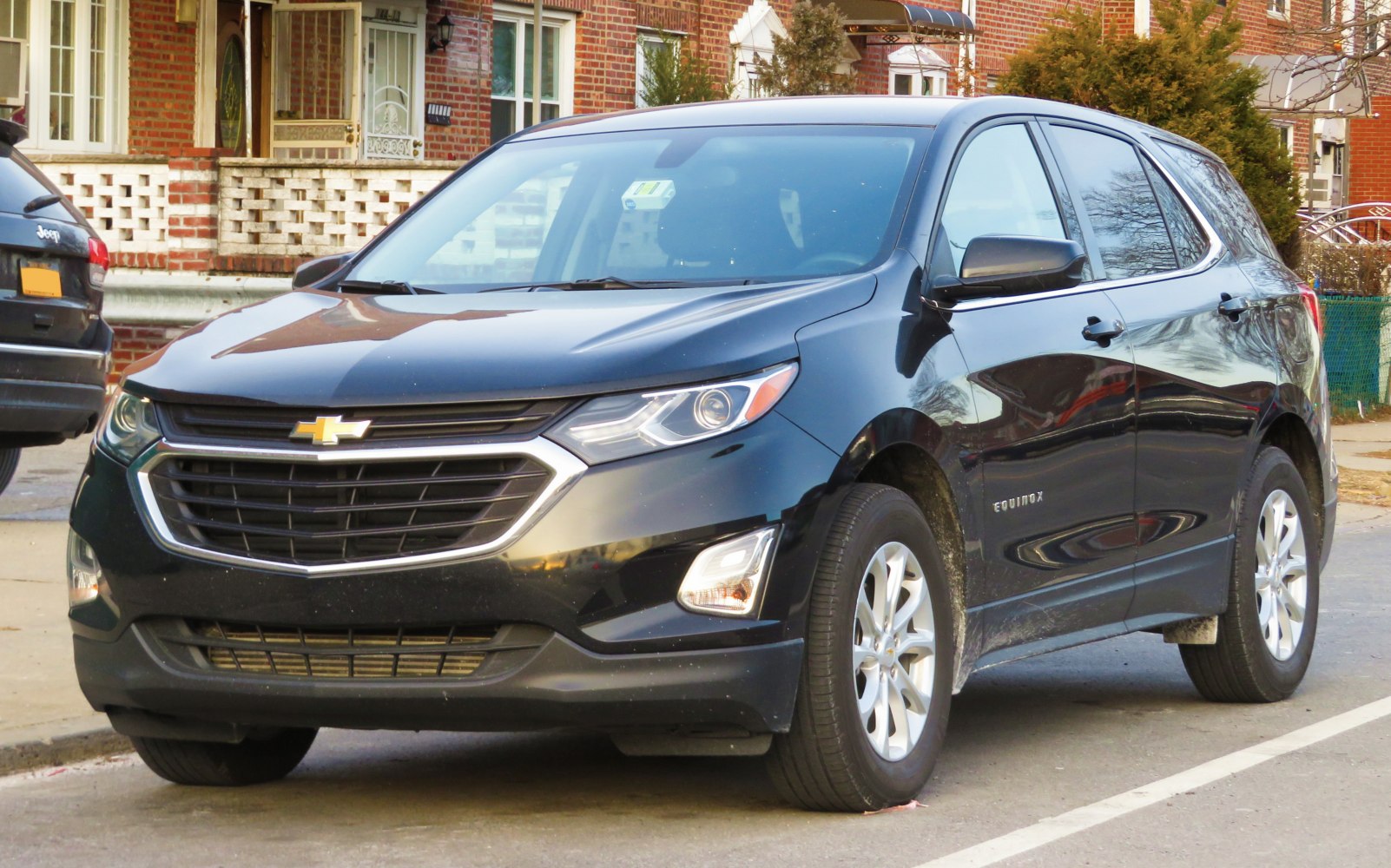 Black SUV with chrome grille and LED headlights