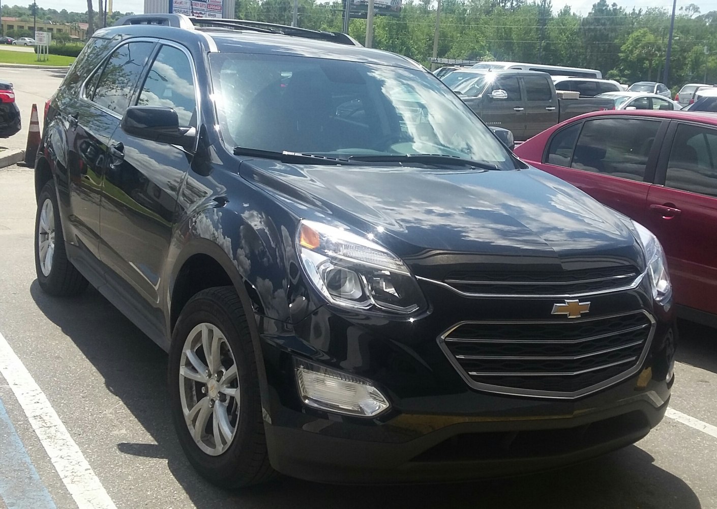 Front three-quarter view showing headlights, grille, and alloy wheels.