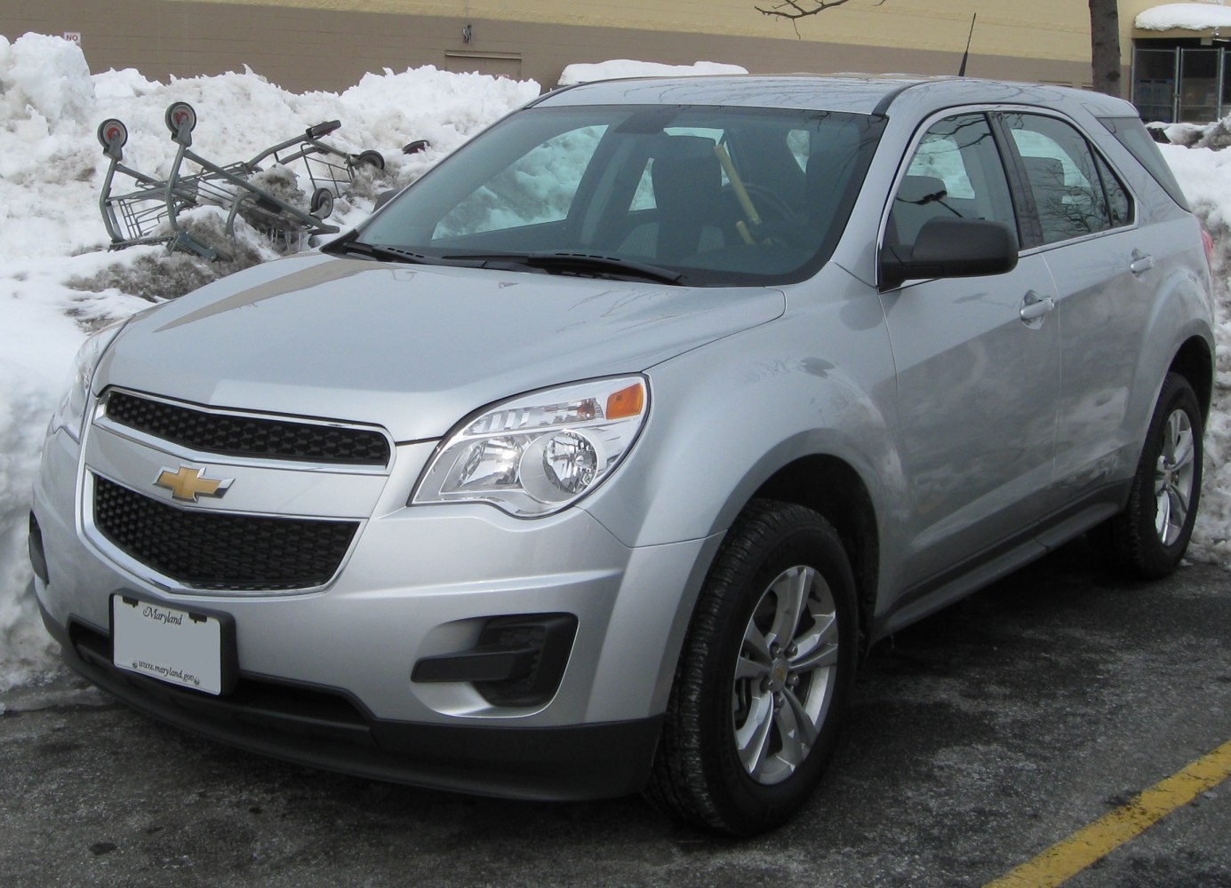 Silver compact SUV with modern headlights and large front grille