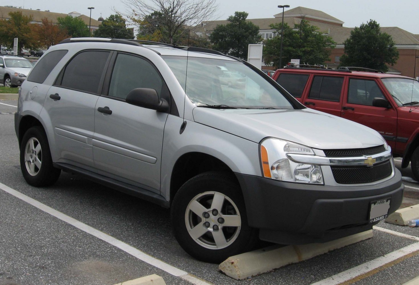 Silver SUV with prominent front headlights and alloy wheels