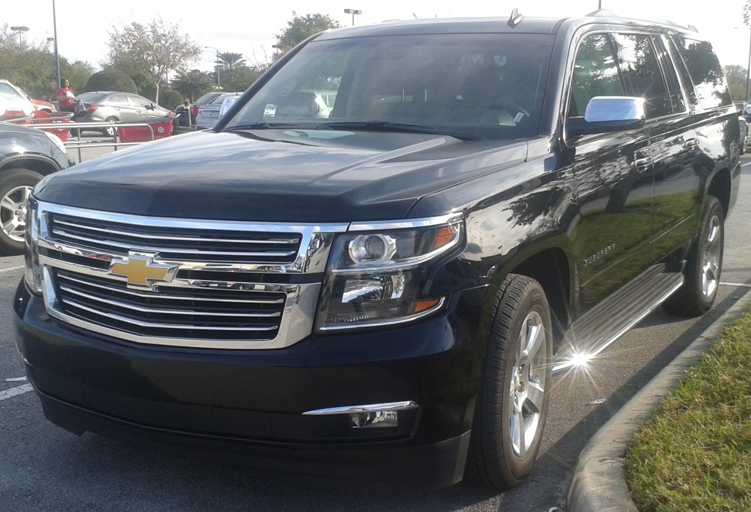 Front grille, headlights, chrome detailing on black SUV