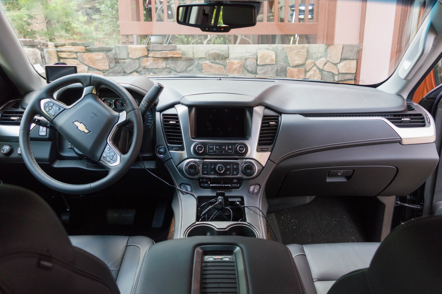 Interior dashboard and multifunction steering wheel with control panel and infotainment system