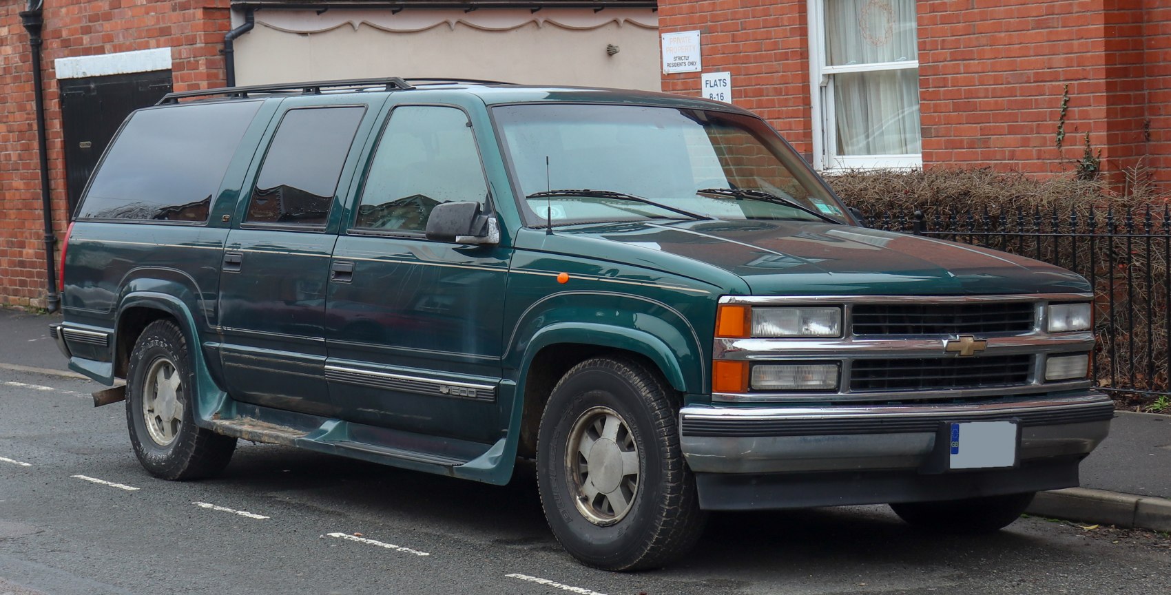 Boxy full-size SUV with chrome trim and running boards