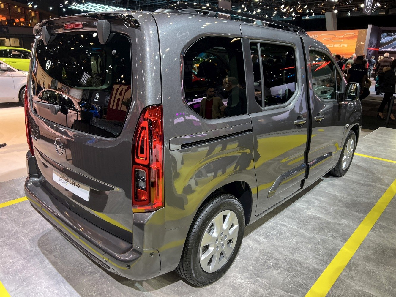 Rear side view with vertical taillights and sliding side doors on a multi-purpose vehicle