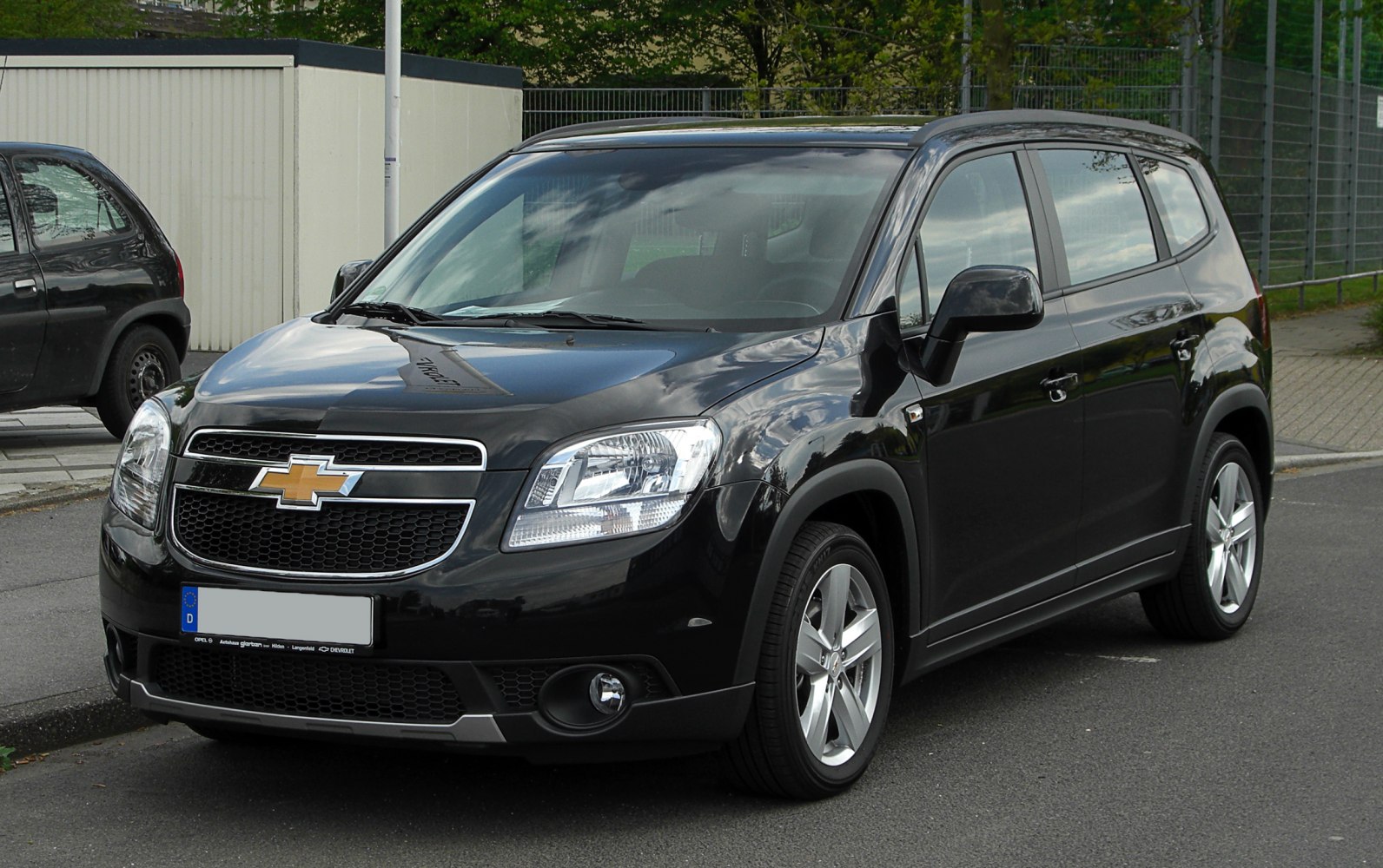Black multi-purpose vehicle with angular headlights and front grille
