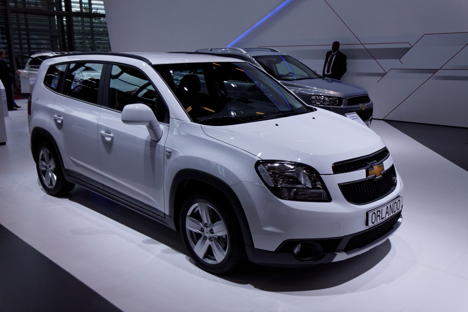 White mid-size SUV with front side view and modern design