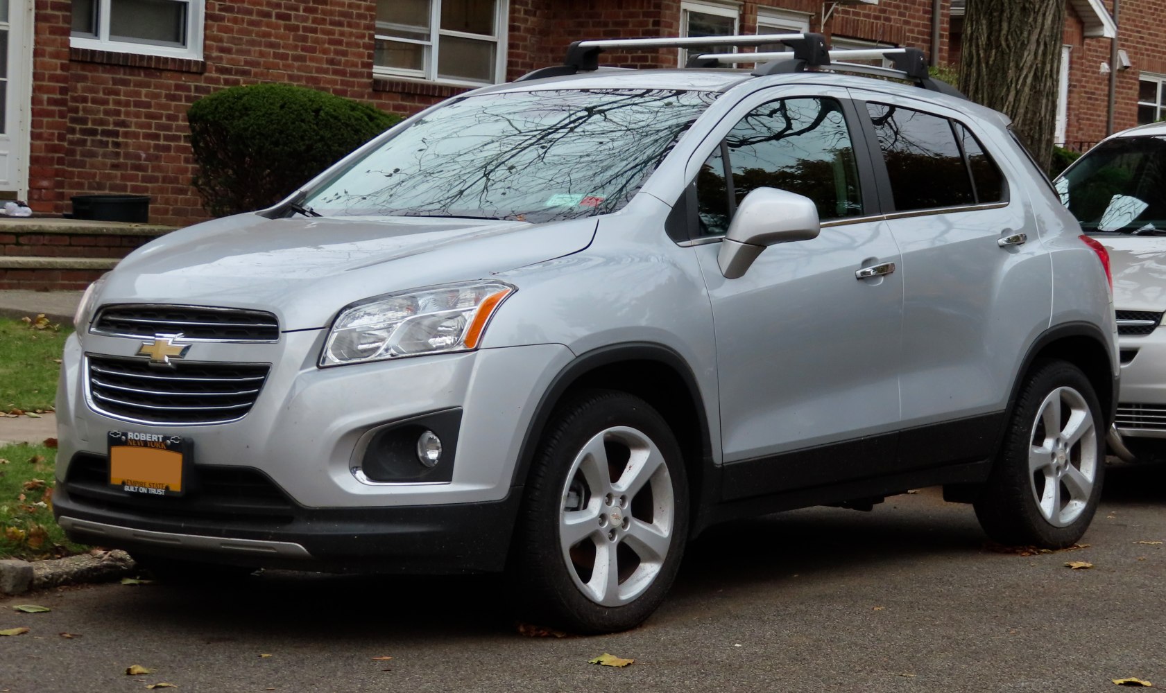 Silver compact SUV with roof rails and alloy wheels