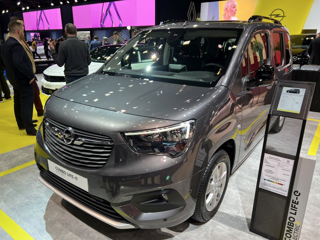 Front view of an electric MPV with grey exterior and modern design.