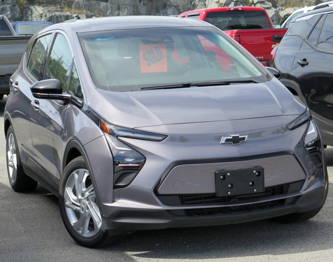 Front view of an electric hatchback with distinctive headlight design