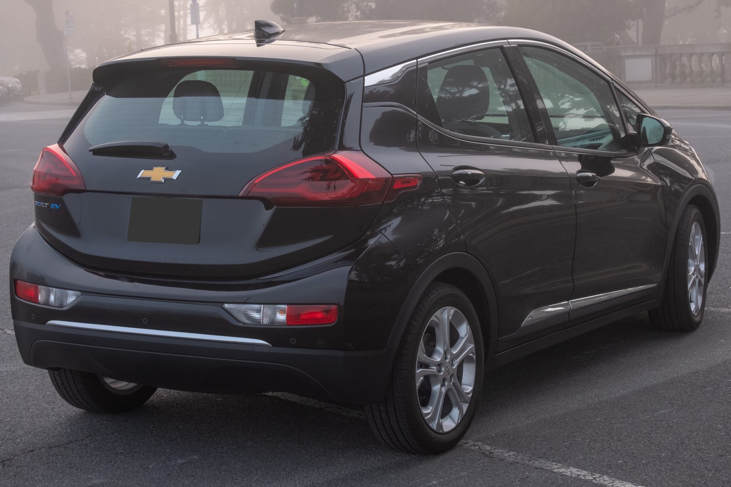 Rear and side view of electric hatchback with distinctive taillights and sleek design