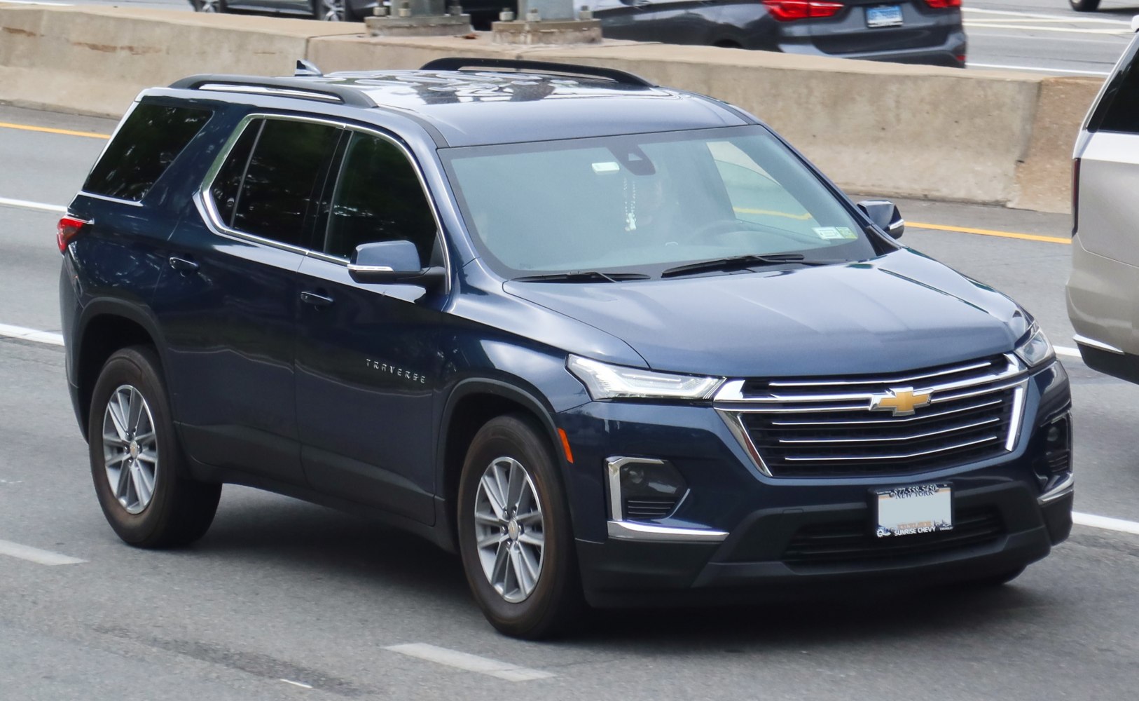 Front and side view of SUV with modern grille and LED headlights
