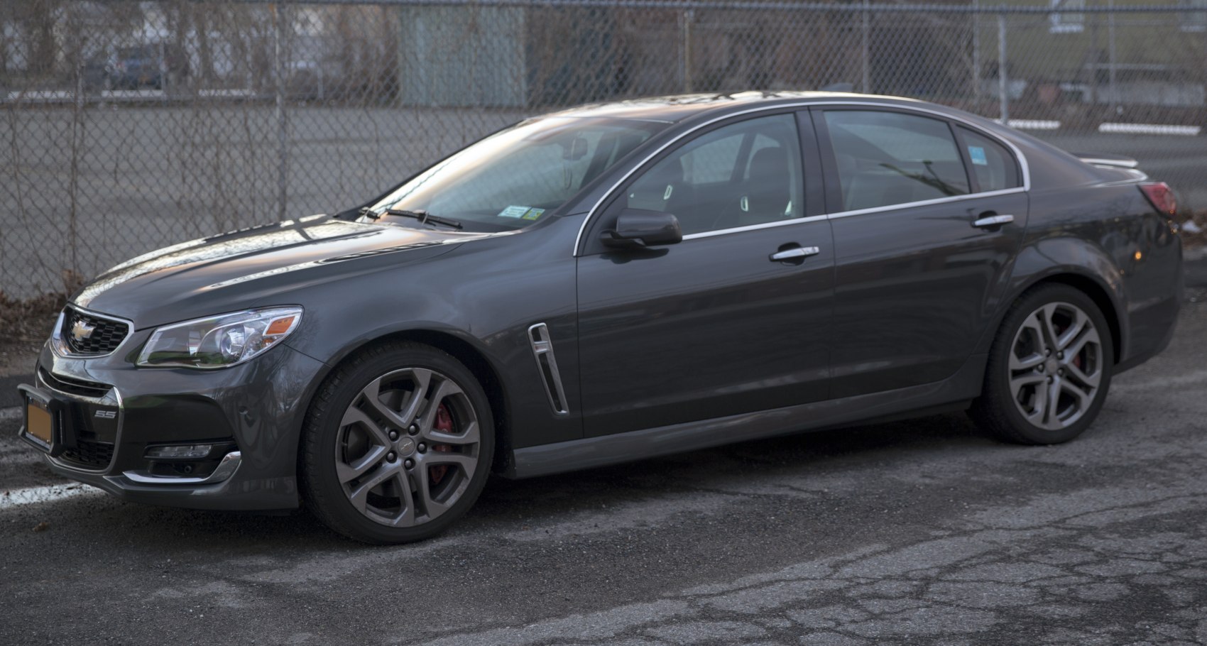 Facelift sedan side view with alloy wheels and red brake calipers