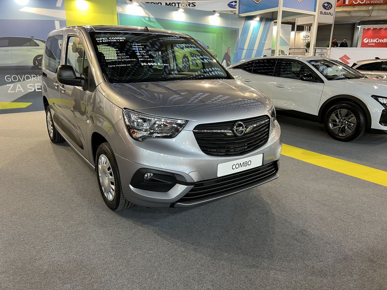 Silver compact van front-side with headlights and grille
