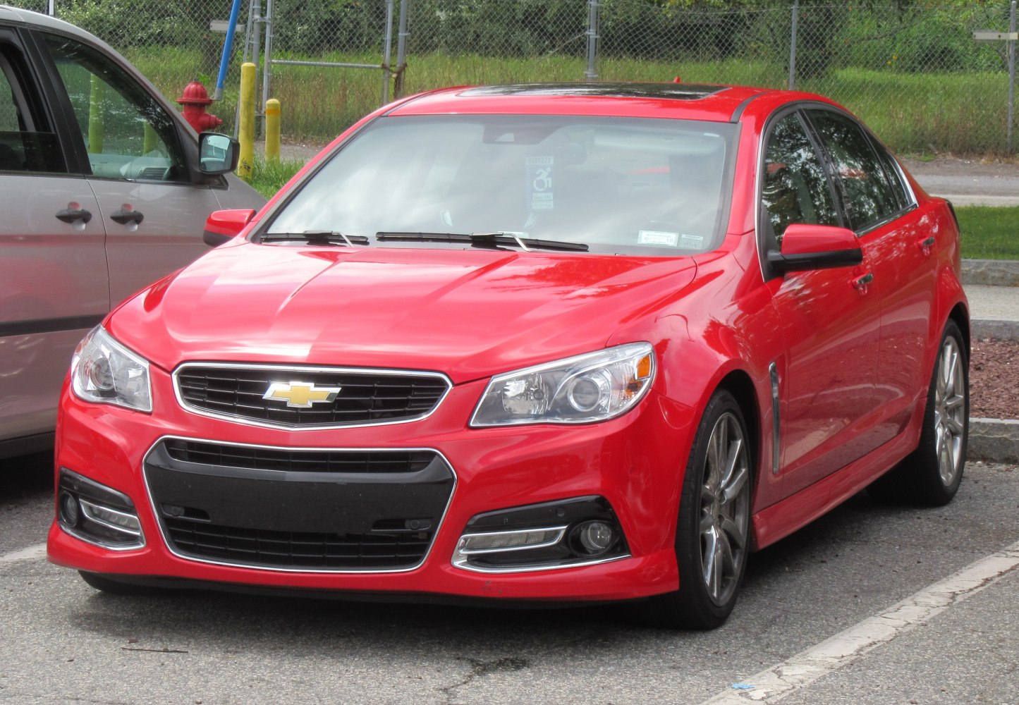 Front view of a sporty sedan with aggressive grille and sleek headlights