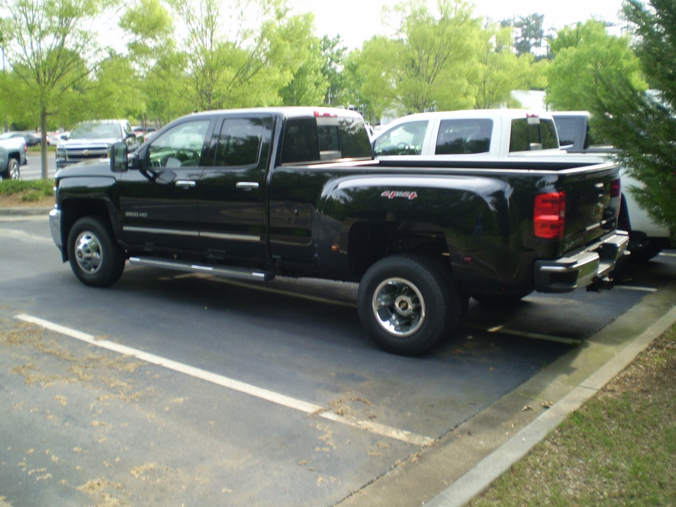 Black heavy duty pickup with double cab and dual rear wheels