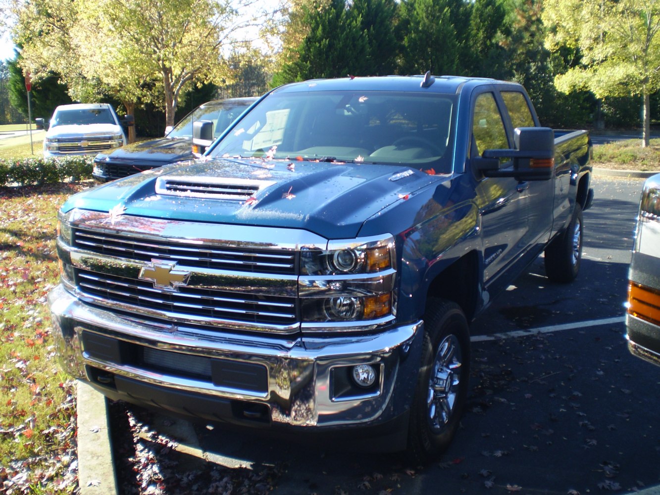 Heavy-duty pickup front grille, hood vent, dual headlights