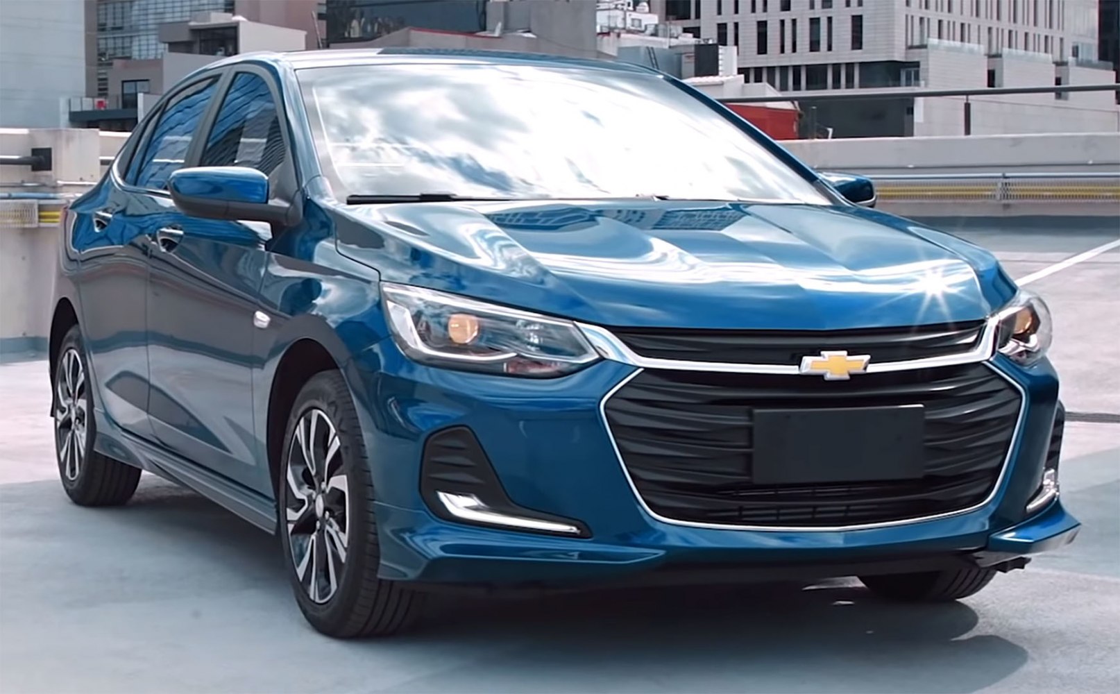 Front view with LED headlights and large grille on a stylish sedan