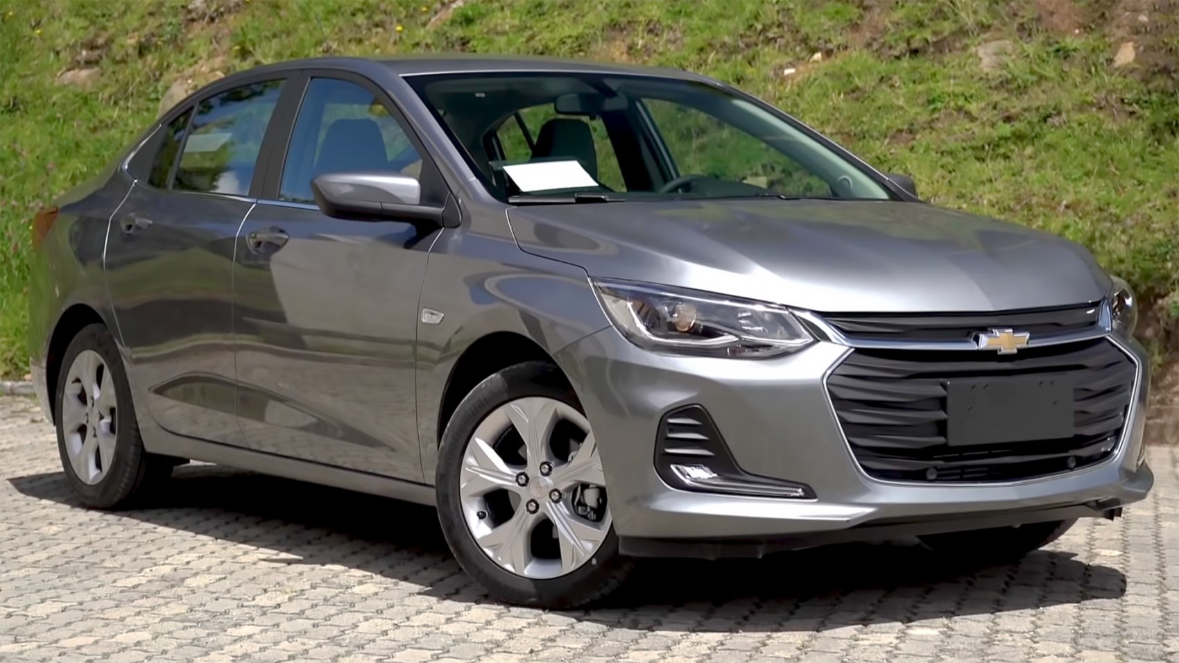 Front and side view of a silver mid-size sedan with alloy wheels and modern headlights