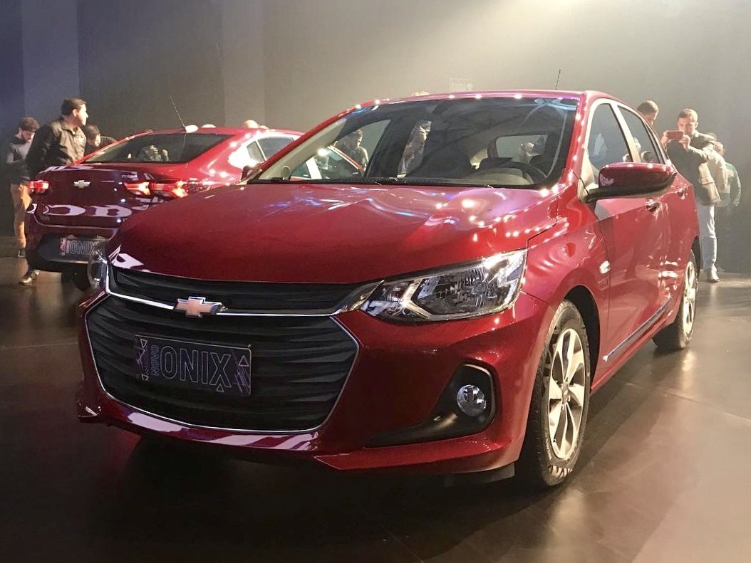Front view with LED headlights, prominent grille, and alloy wheels