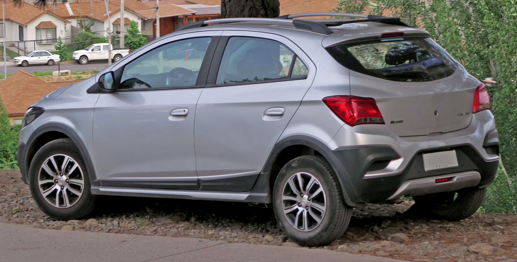 Silver hatchback side and rear view with alloy wheels and body cladding
