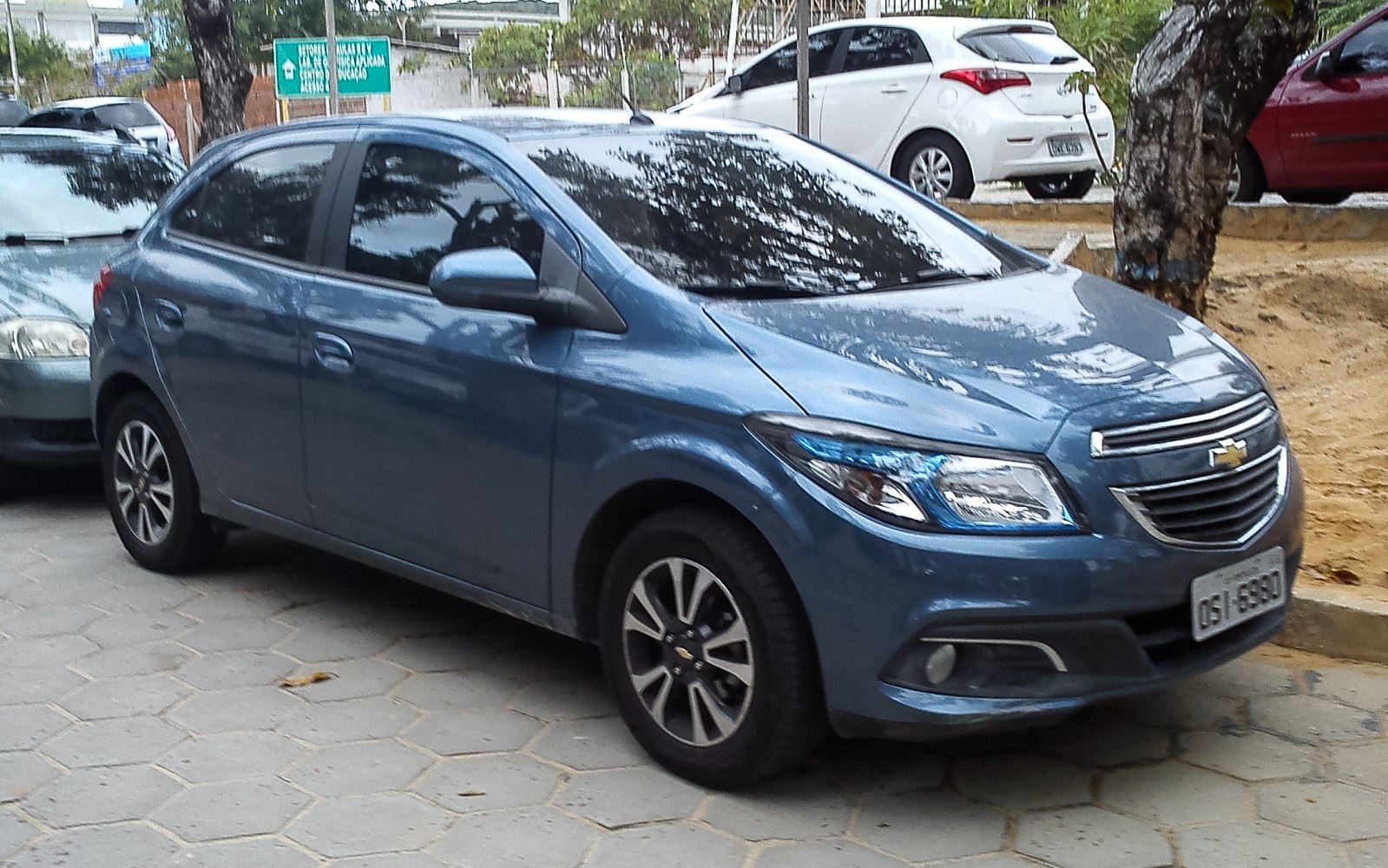 Front side view of a compact hatchback with alloy wheels