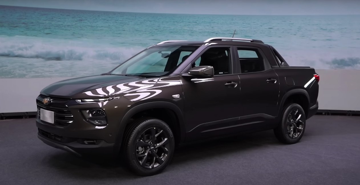 Front side view of modern black pickup with alloy wheels and streamlined design
